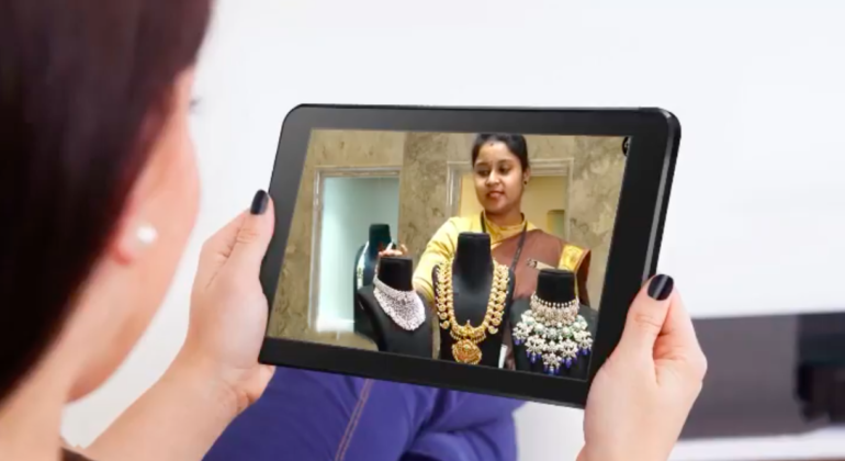 A jewellery sales person is showcasing the store jewellery to their customer using JewelMeet video calling feature